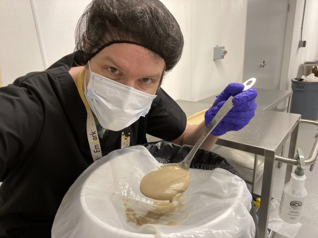 The Bubbleman scooping bubble hash in a lab