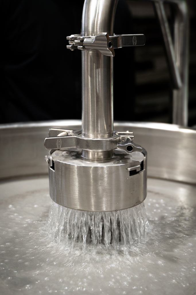 Water pouring out of the separator shower head on the WT-300 ice water extraction system